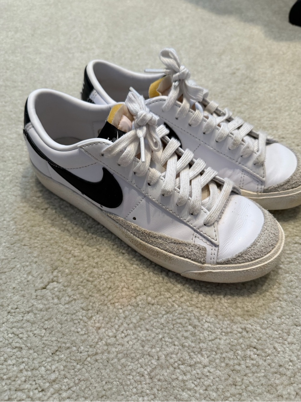 Nike White Leather Low-Top Sneakers with Black Swoosh and Gray Suede Accents